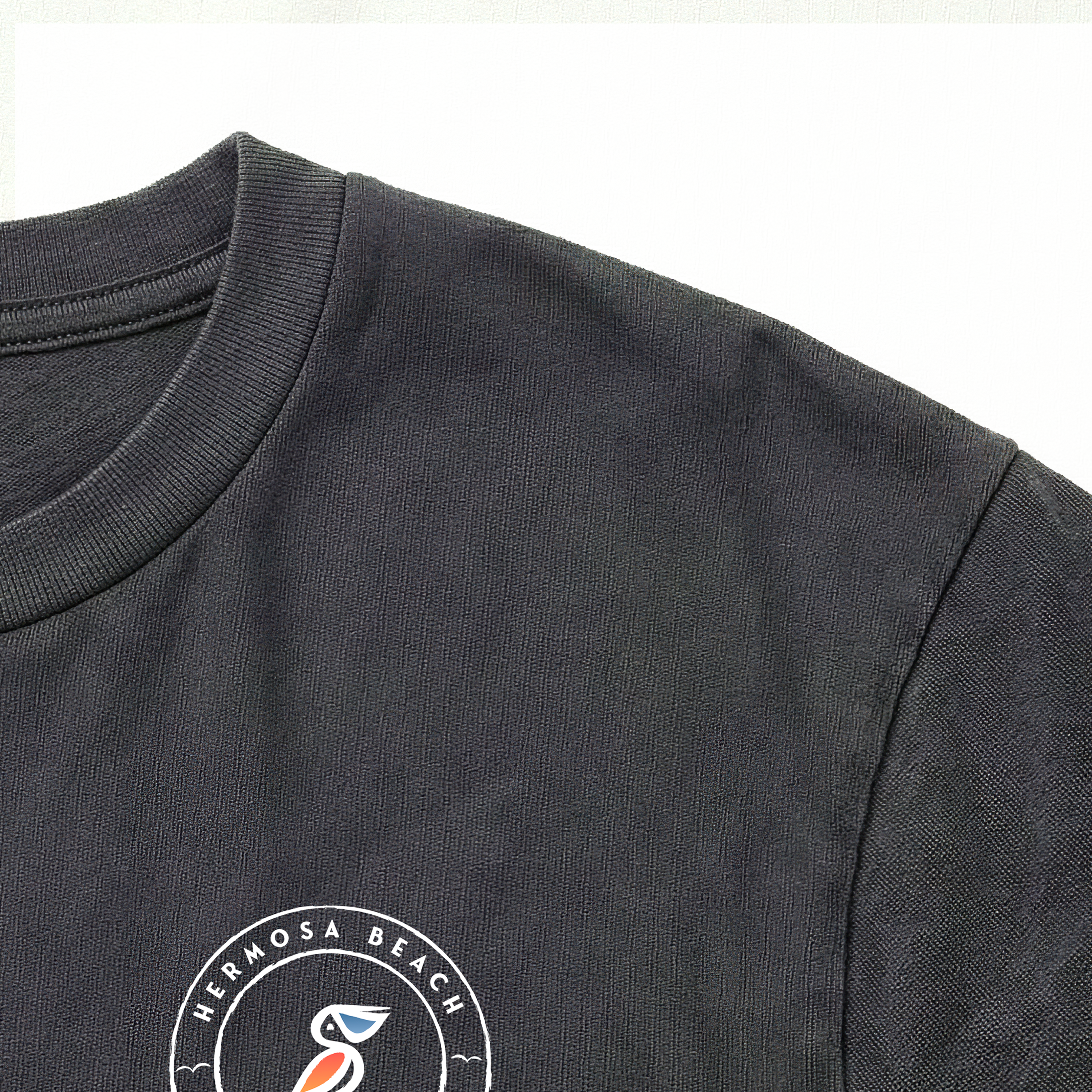 Vintage Black t-shirt with a logo on the sleeve against a white background