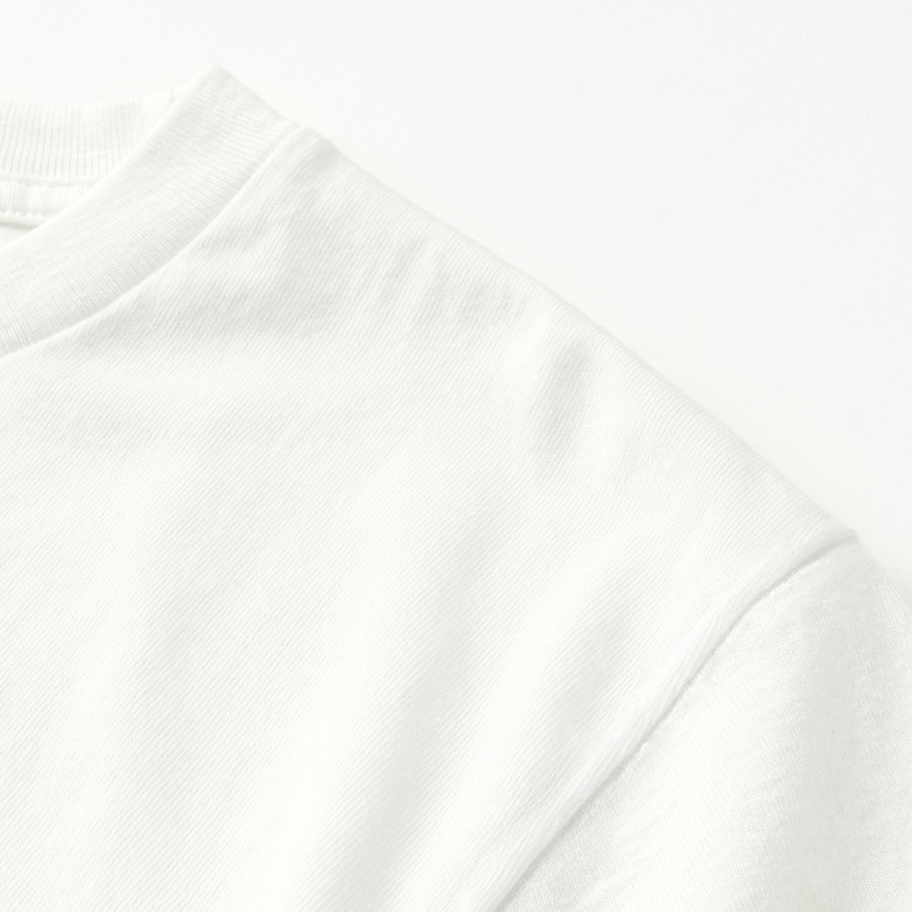 Close-up of a white t-shirt fabric texture