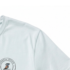 Dusty Blue T-shirt with a logo on the chest area against a white background