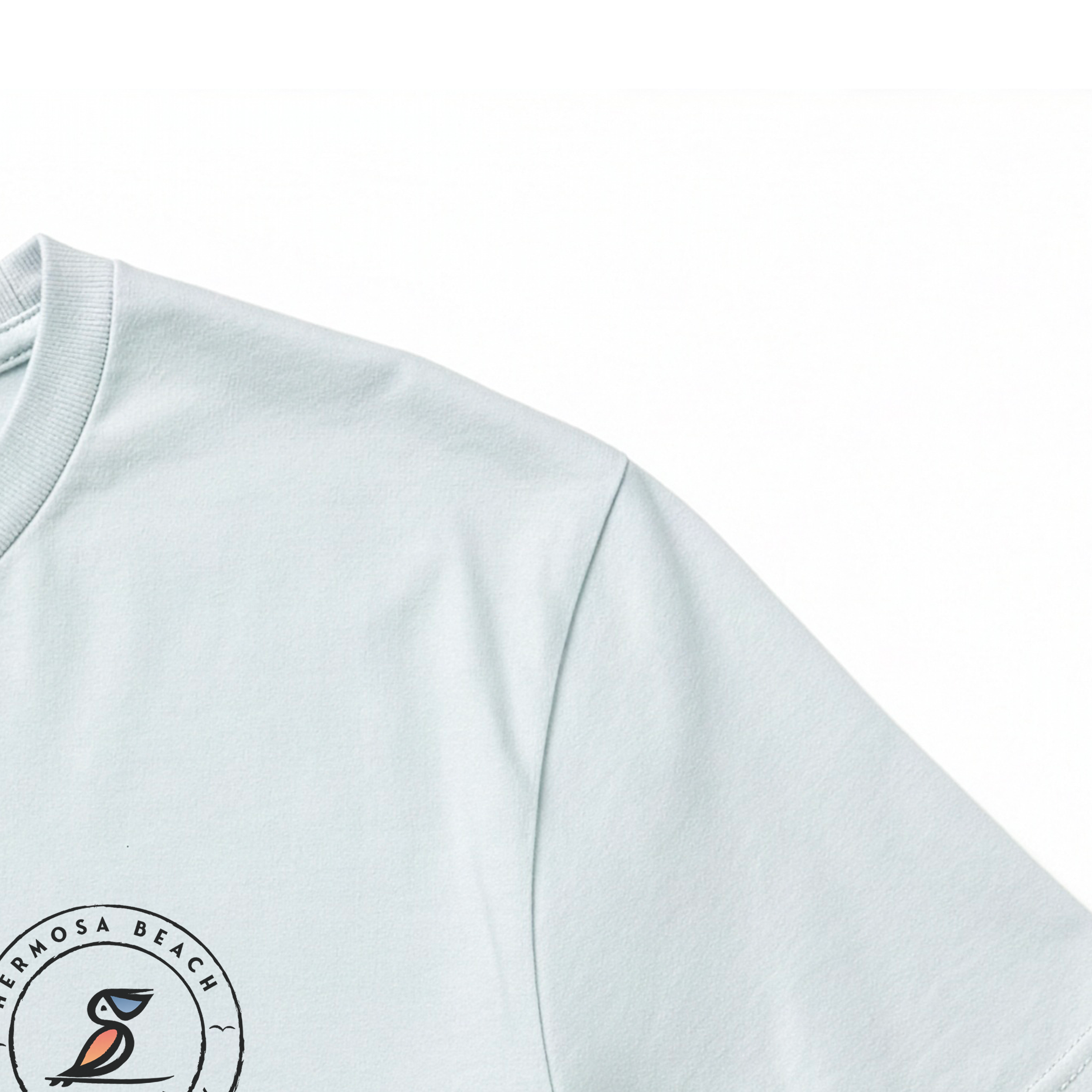 Dusty Blue T-shirt with a logo on the chest area against a white background